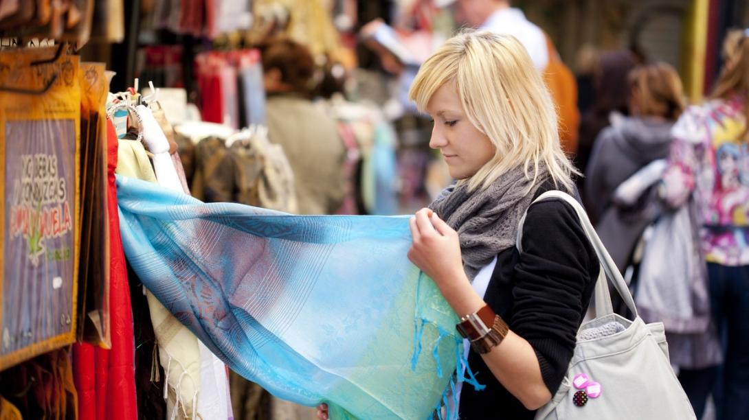 Volunteer learns about ethical consumerism and fast fashion in Cambodia. Traveller explores a local market in Cambodia.